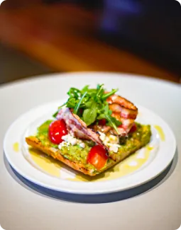 Avocado toast on a white plate